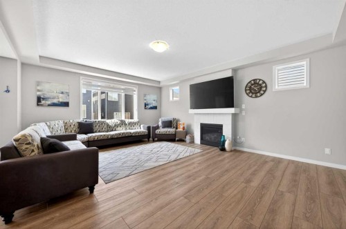 95 Carrington Close Nw, Calgary, AB - Indoor Photo Showing Living Room With Fireplace