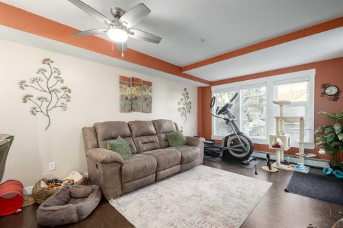 2105-11 Mahogany Row Se, Calgary, AB - Indoor Photo Showing Living Room