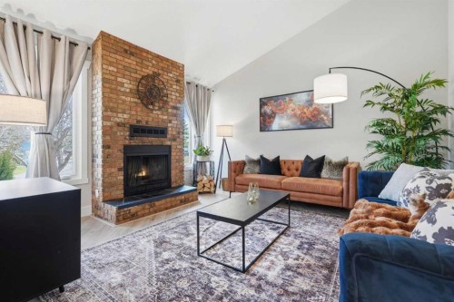 71 Woodfield Drive Sw, Calgary, AB - Indoor Photo Showing Living Room With Fireplace