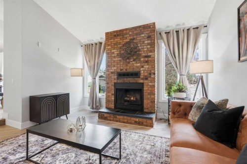 71 Woodfield Drive Sw, Calgary, AB - Indoor Photo Showing Living Room With Fireplace