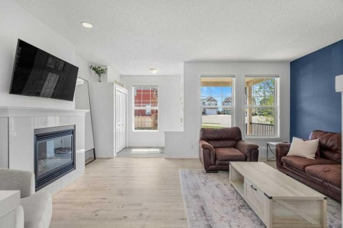 142 Auburn Crest Way Se, Calgary, AB - Indoor Photo Showing Living Room With Fireplace