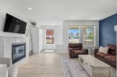 142 Auburn Crest Way Se, Calgary, AB  - Indoor Photo Showing Living Room With Fireplace 