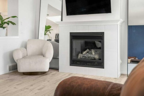 142 Auburn Crest Way Se, Calgary, AB - Indoor Photo Showing Living Room With Fireplace