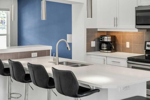 142 Auburn Crest Way Se, Calgary, AB - Indoor Photo Showing Kitchen With Double Sink