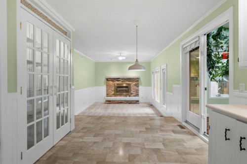 164 Sun Valley Drive Se, Calgary, AB - Indoor Photo Showing Other Room With Fireplace