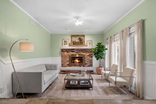164 Sun Valley Drive Se, Calgary, AB - Indoor Photo Showing Living Room With Fireplace