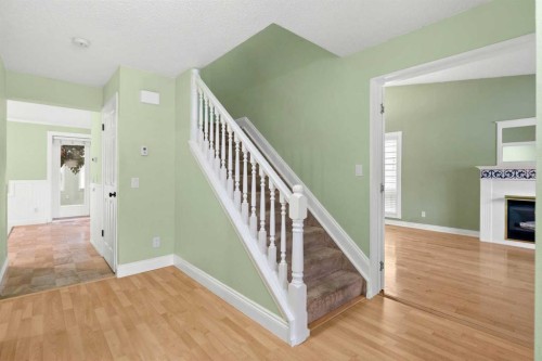 164 Sun Valley Drive Se, Calgary, AB - Indoor Photo Showing Other Room With Fireplace