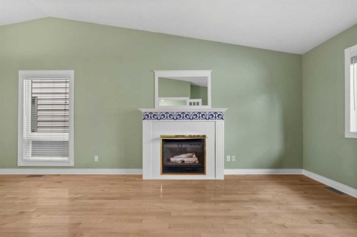 164 Sun Valley Drive Se, Calgary, AB - Indoor Photo Showing Other Room With Fireplace