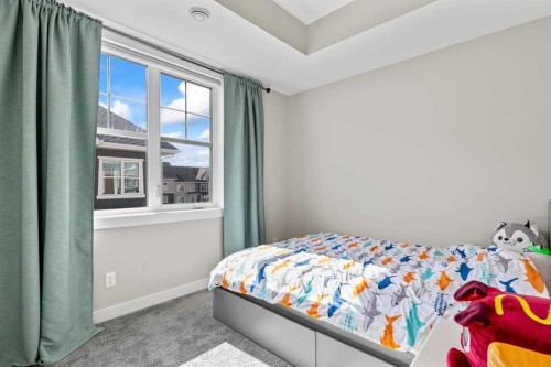 306 Cranbrook Walk Se, Calgary, AB - Indoor Photo Showing Bedroom