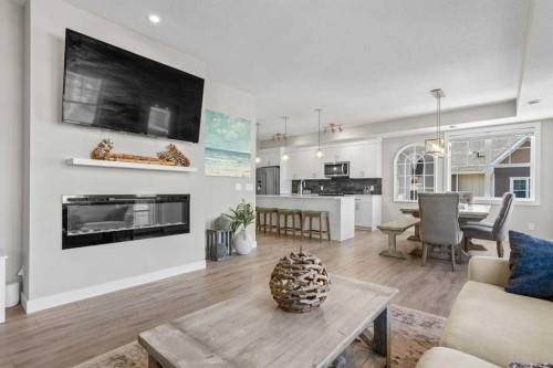 306 Cranbrook Walk Se, Calgary, AB - Indoor Photo Showing Living Room With Fireplace