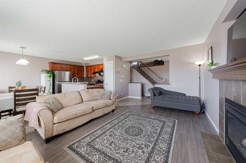 133 Saddlefield Place Ne, Calgary, AB - Indoor Photo Showing Living Room With Fireplace