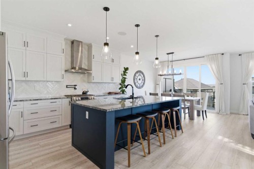 303 Rivercrest Boulevard, Cochrane, AB - Indoor Photo Showing Kitchen With Upgraded Kitchen