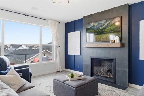 303 Rivercrest Boulevard, Cochrane, AB - Indoor Photo Showing Living Room With Fireplace