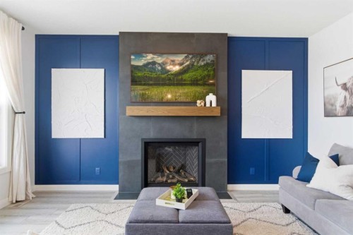 303 Rivercrest Boulevard, Cochrane, AB - Indoor Photo Showing Living Room With Fireplace