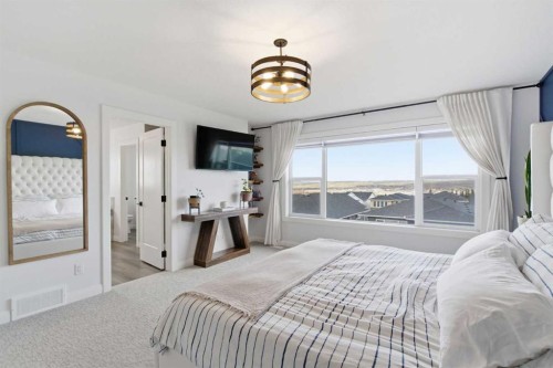 303 Rivercrest Boulevard, Cochrane, AB - Indoor Photo Showing Bedroom