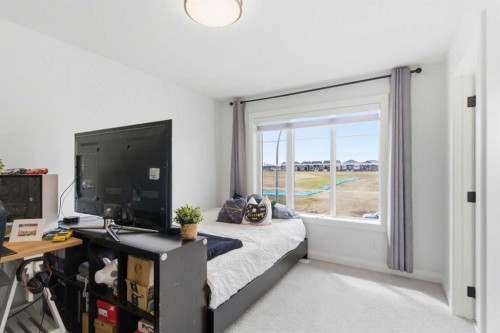 303 Rivercrest Boulevard, Cochrane, AB - Indoor Photo Showing Bedroom