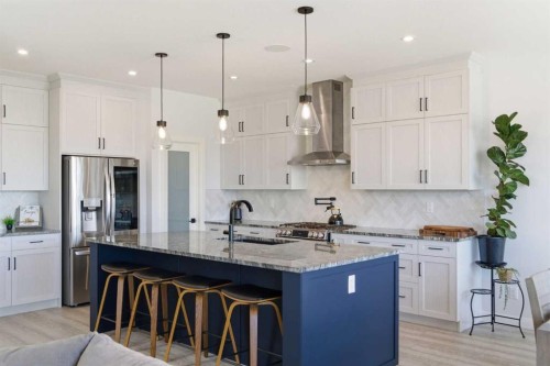 303 Rivercrest Boulevard, Cochrane, AB - Indoor Photo Showing Kitchen With Stainless Steel Kitchen With Upgraded Kitchen