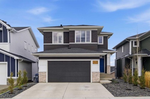 303 Rivercrest Boulevard, Cochrane, AB - Outdoor With Facade