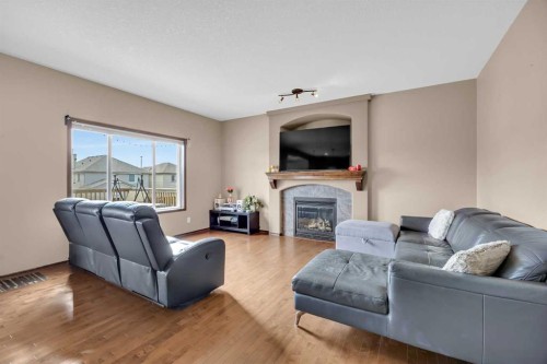 92 Everoak Close Sw, Calgary, AB - Indoor Photo Showing Living Room With Fireplace