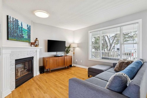 4324 Passchendaele Road Sw, Calgary, AB - Indoor Photo Showing Living Room With Fireplace
