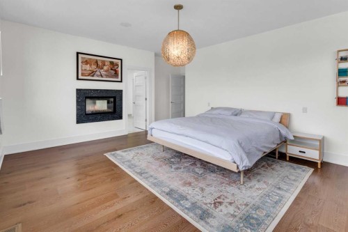 2540 2 Avenue Nw, Calgary, AB - Indoor Photo Showing Bedroom With Fireplace