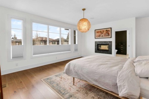 2540 2 Avenue Nw, Calgary, AB - Indoor Photo Showing Bedroom With Fireplace