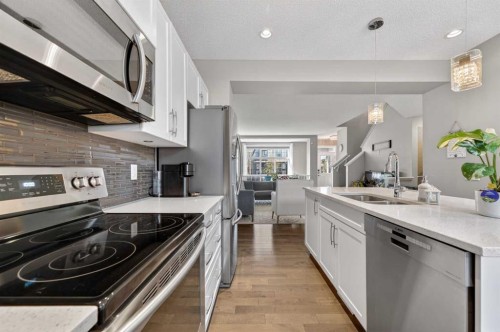64 Masters Link Se, Calgary, AB - Indoor Photo Showing Kitchen With Stainless Steel Kitchen With Double Sink With Upgraded Kitchen