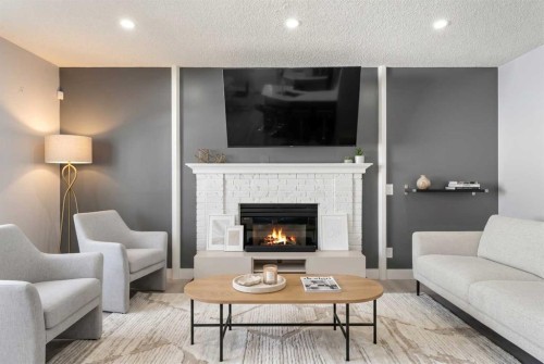 48 Douglas Park Boulevard Se, Calgary, AB - Indoor Photo Showing Living Room With Fireplace