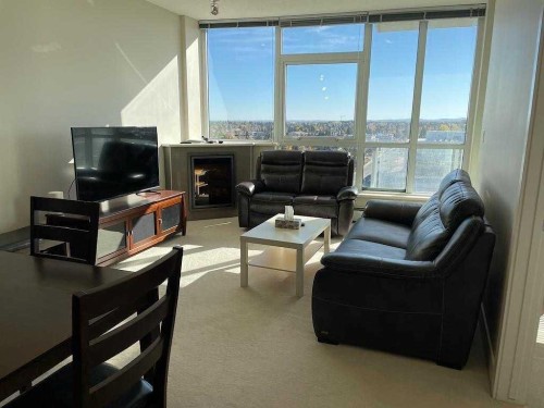 1104-99 Spruce Place Sw, Calgary, AB - Indoor Photo Showing Living Room