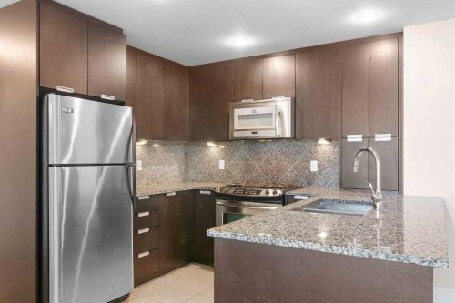1104-99 Spruce Place Sw, Calgary, AB - Indoor Photo Showing Kitchen With Upgraded Kitchen