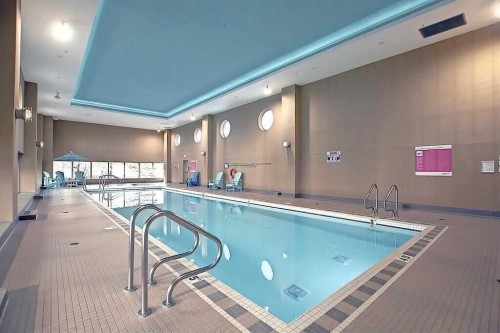 1104-99 Spruce Place Sw, Calgary, AB - Indoor Photo Showing Other Room With In Ground Pool