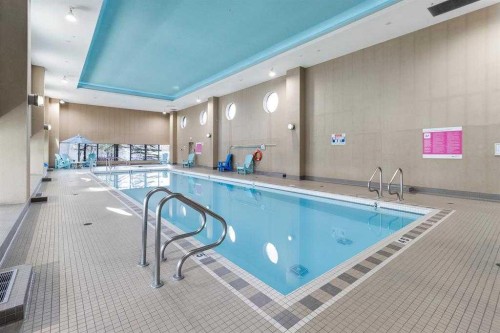 1104-99 Spruce Place Sw, Calgary, AB - Indoor Photo Showing Other Room With In Ground Pool