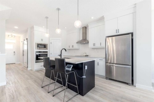 99 Haskayne Drive Nw, Calgary, AB - Indoor Photo Showing Kitchen With Upgraded Kitchen