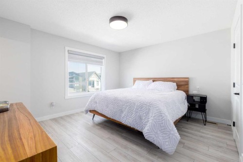 99 Haskayne Drive Nw, Calgary, AB - Indoor Photo Showing Bedroom