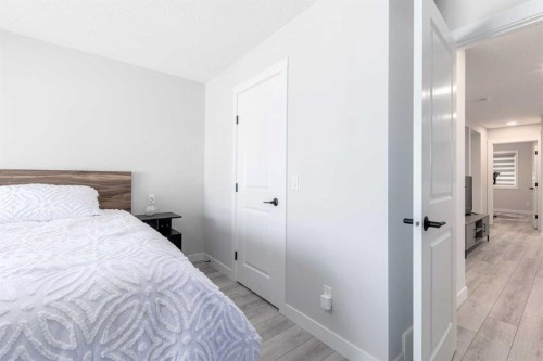 99 Haskayne Drive Nw, Calgary, AB - Indoor Photo Showing Bedroom