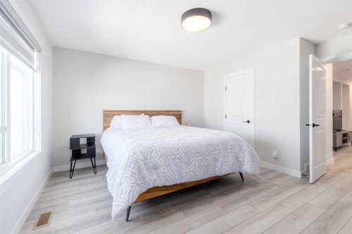 99 Haskayne Drive Nw, Calgary, AB - Indoor Photo Showing Bedroom