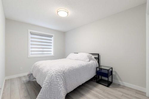 99 Haskayne Drive Nw, Calgary, AB - Indoor Photo Showing Bedroom