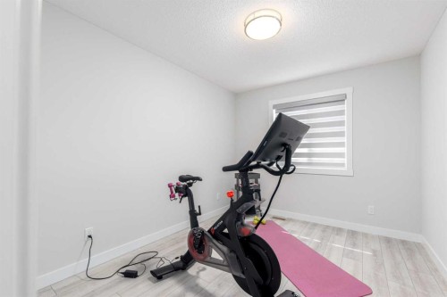 99 Haskayne Drive Nw, Calgary, AB - Indoor Photo Showing Gym Room