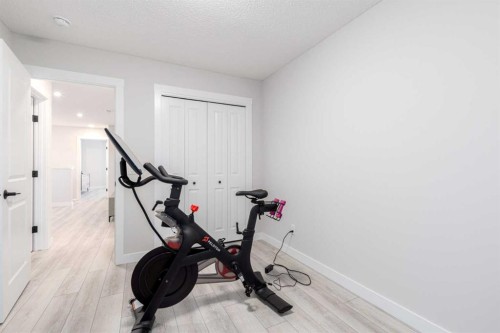 99 Haskayne Drive Nw, Calgary, AB - Indoor Photo Showing Gym Room