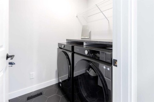 99 Haskayne Drive Nw, Calgary, AB - Indoor Photo Showing Laundry Room