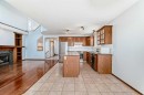 42 Harvest Rose Place Ne, Calgary, AB  - Indoor Photo Showing Kitchen With Fireplace 