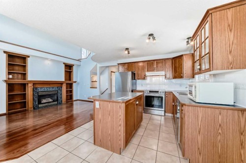 42 Harvest Rose Place Ne, Calgary, AB - Indoor Photo Showing Kitchen With Fireplace