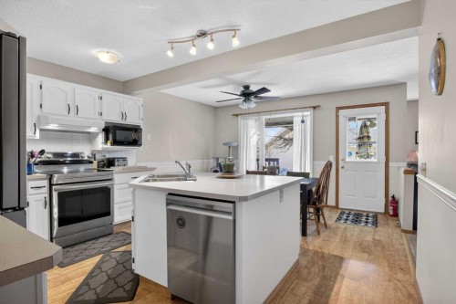44 Riverwood Circle Se, Calgary, AB - Indoor Photo Showing Kitchen With Double Sink