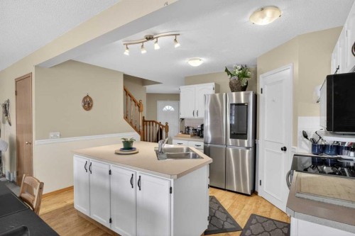 44 Riverwood Circle Se, Calgary, AB - Indoor Photo Showing Kitchen With Double Sink