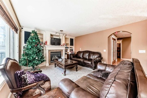 602 Wentworth Place Sw, Calgary, AB - Indoor Photo Showing Living Room With Fireplace