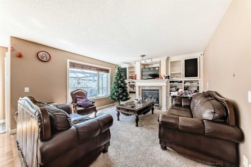 602 Wentworth Place Sw, Calgary, AB - Indoor Photo Showing Living Room With Fireplace