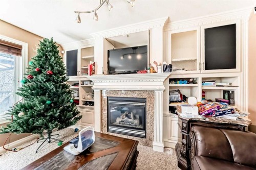 602 Wentworth Place Sw, Calgary, AB - Indoor Photo Showing Other Room With Fireplace