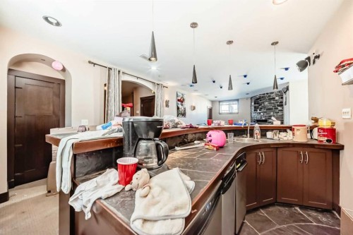 602 Wentworth Place Sw, Calgary, AB - Indoor Photo Showing Kitchen With Fireplace