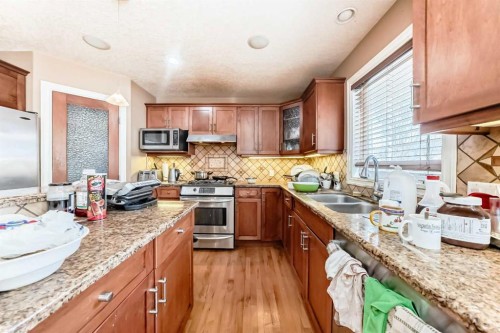 602 Wentworth Place Sw, Calgary, AB - Indoor Photo Showing Kitchen With Stainless Steel Kitchen With Double Sink With Upgraded Kitchen