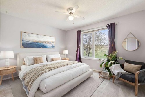 34-105 Elm Place, Okotoks, AB - Indoor Photo Showing Bedroom